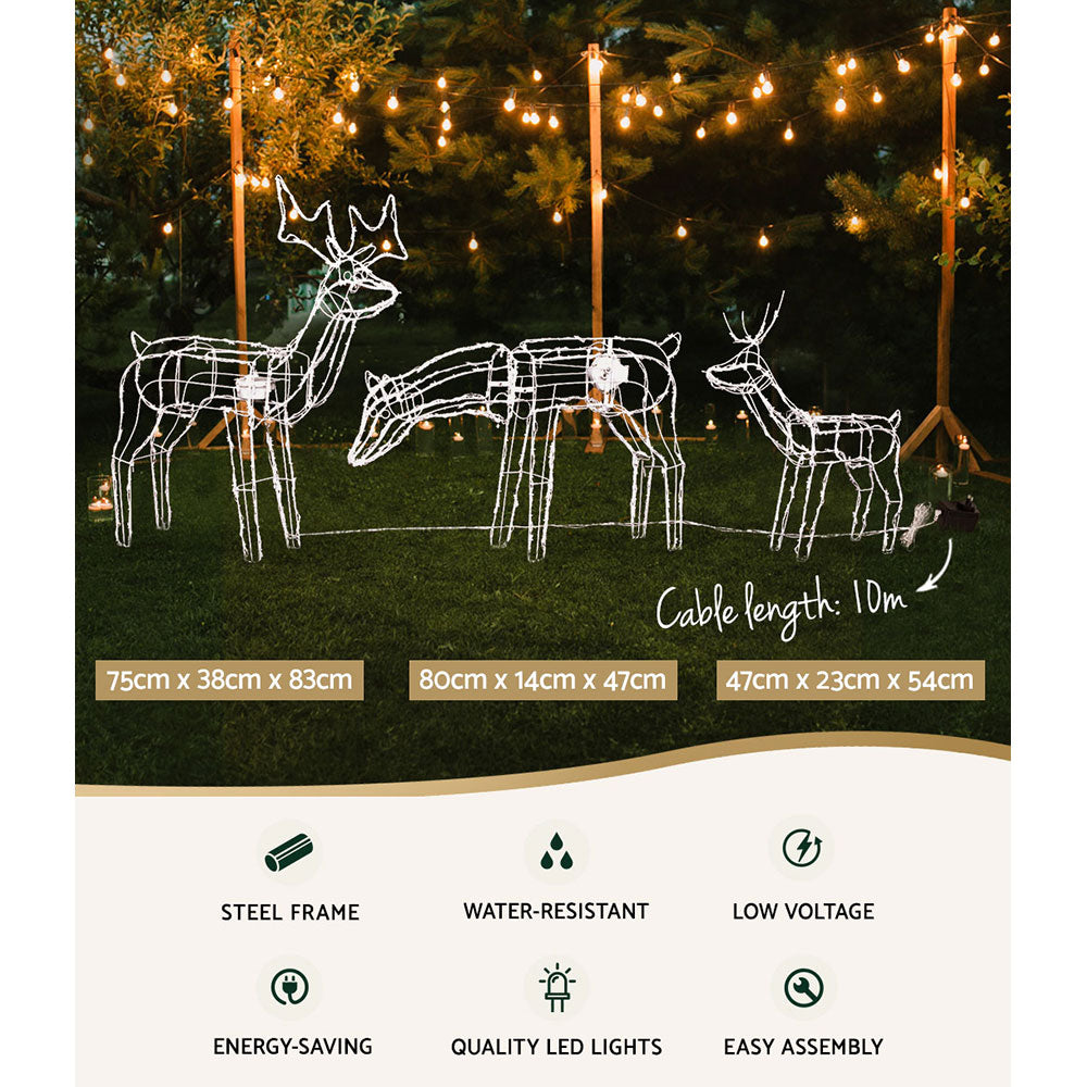 Three lit reindeer wireframe light decorations for outdoor yard display