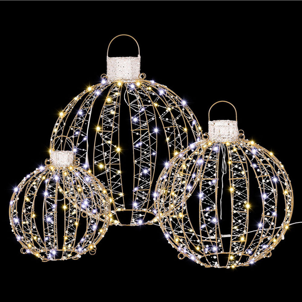 Gold wire Christmas light ball set with warm white LED strands, three hanging baubles