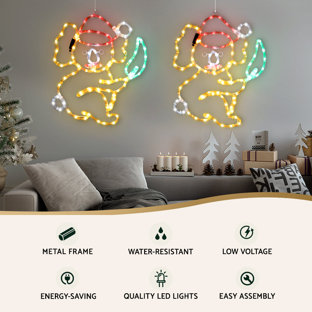 Lit LED rope light angel motifs with red hats, gold outlines, green highlights, and white bulbs