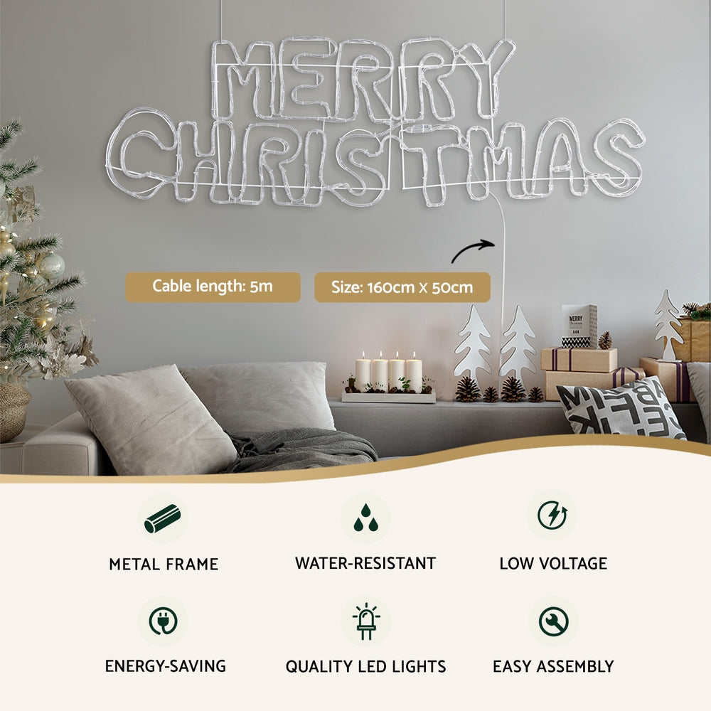 Hanging wireframe LED Christmas light motif spelling MERRY CHRISTMAS with connected cable
