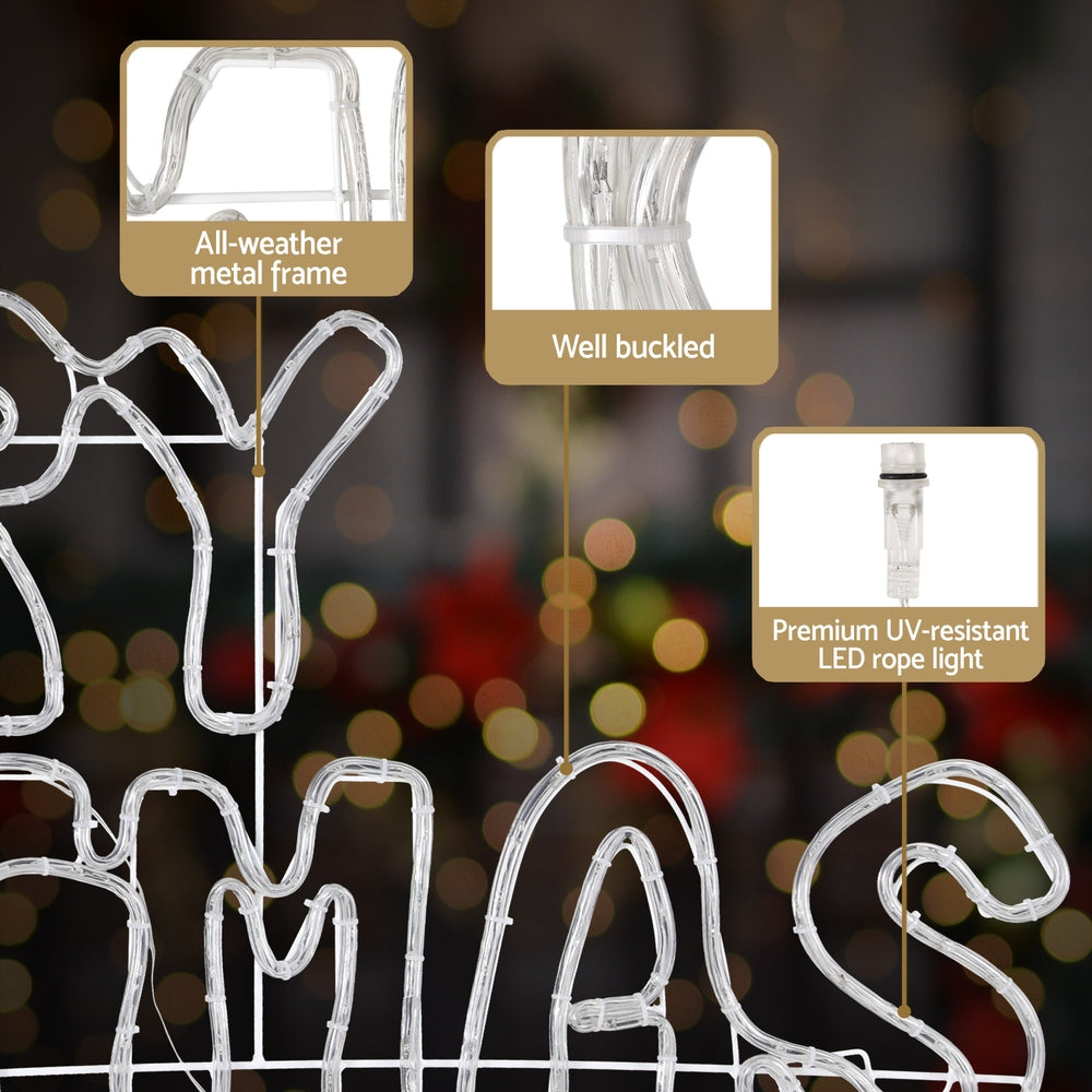 White rope light wireframe Christmas motif spelling MERRY CHRISTMAS with controller plug