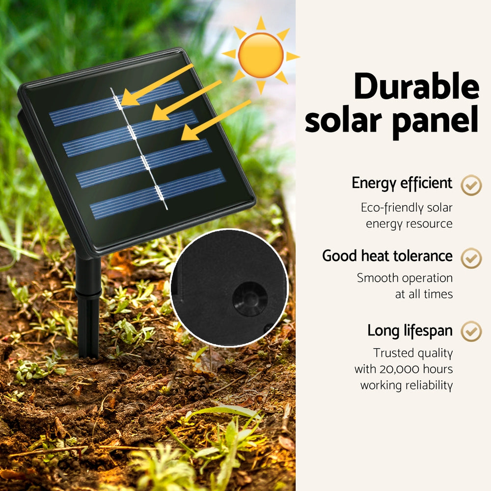 Solar-powered LED light system with black solar panel stake on outdoor ground