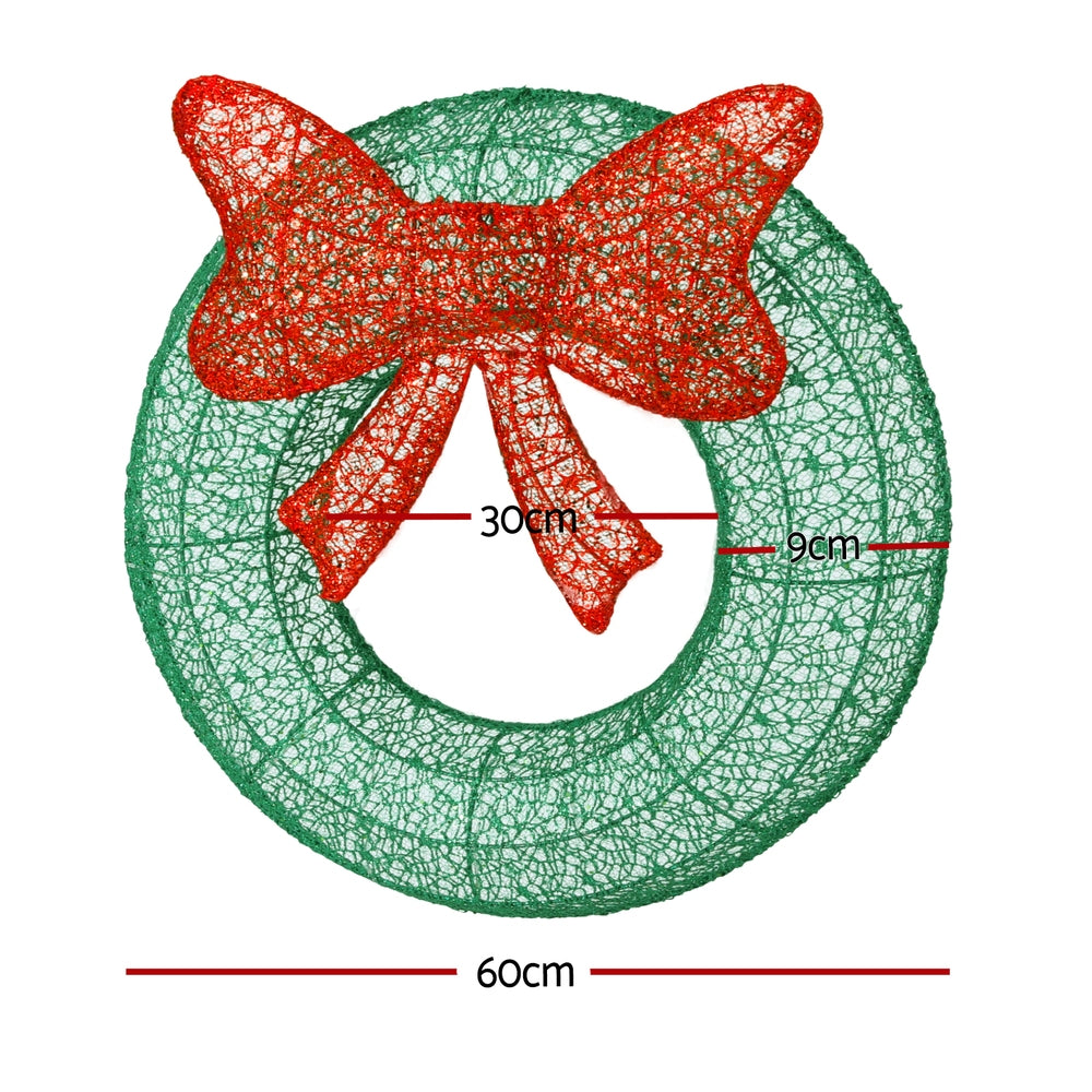Solar wreath light decoration with red bow; 60cm ring, 30cm wide, 9cm deep