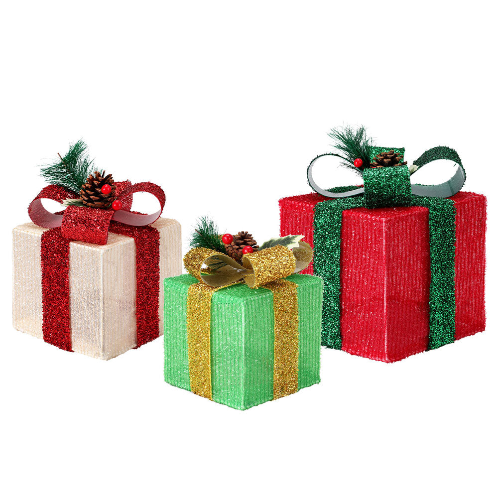 Three glitter gift box fairy lights with ribbon bows in red, green, white, and gold tones.