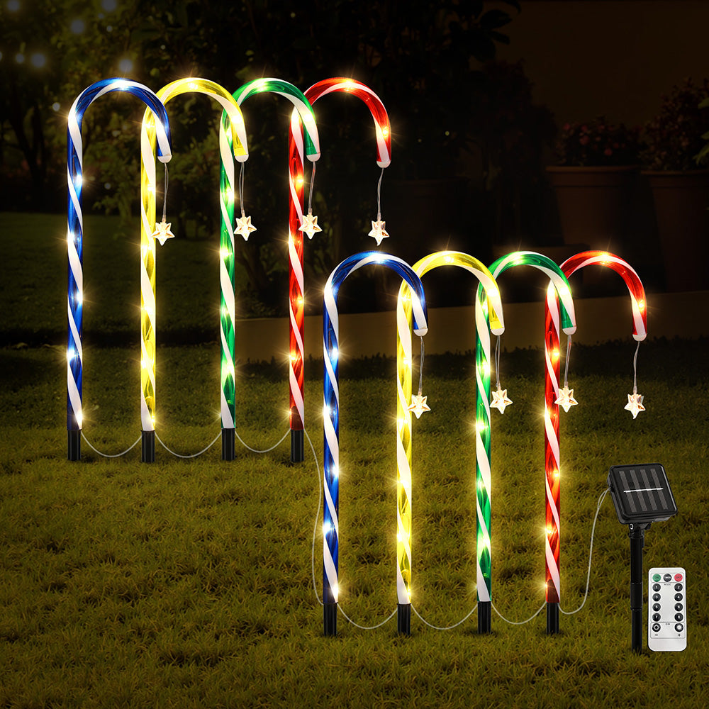Eight multicolor LED solar path lights with spiral tubes, spike stakes, solar panel, and remote