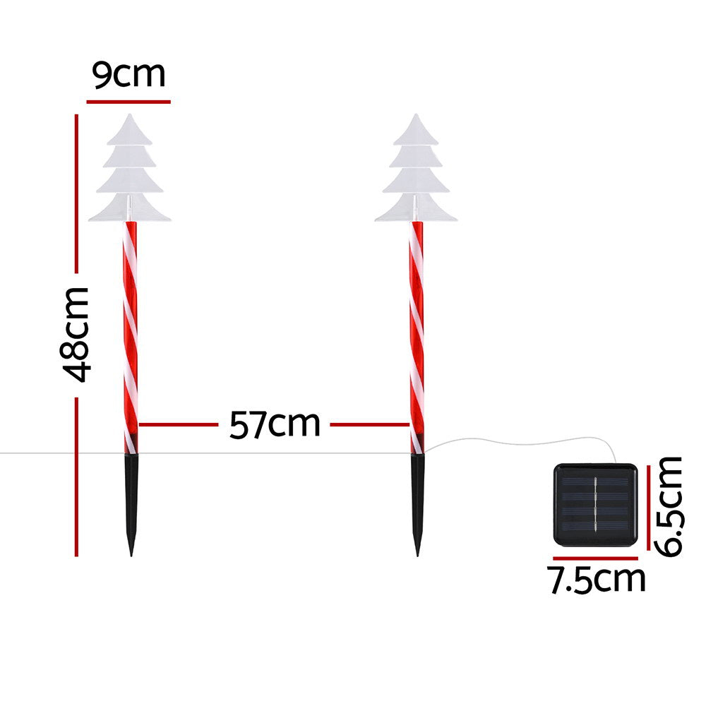 Solar ground Christmas lights with striped red-white stakes and frosted tree LED tops