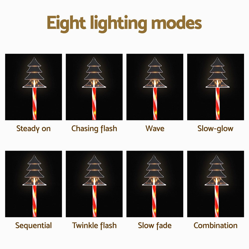 Christmas solar lights with tree LED caps on striped red-white stakes, multiple lighting modes