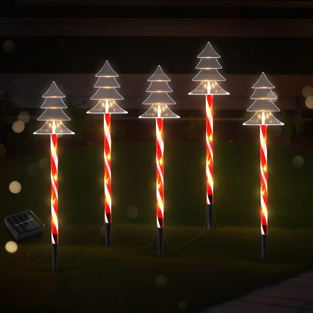 Solar ground Christmas lights with glowing tree LED heads on striped red-white stakes