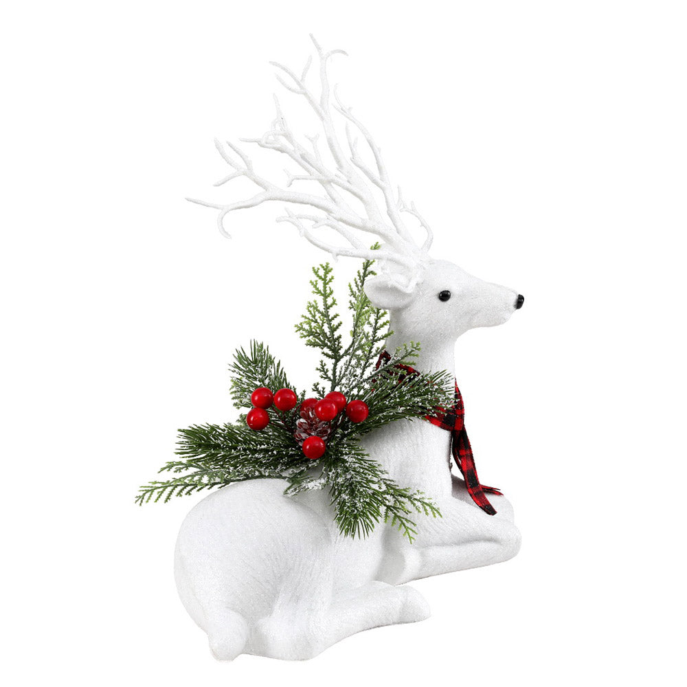 Christmas deer ornament, plush white reindeer lying with antlers, holding pine and red berries, plaid scarf.