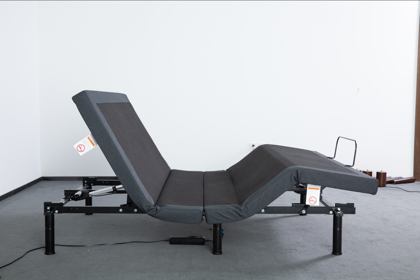 Adjustable bed base set in Zero-G position elevating head and legs for pressure relief